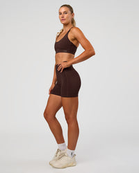Woman wearing Rapid Sports Bra - Hot Chocolate | Model:Emelia | Size:XS | Thumbnail Index: 2