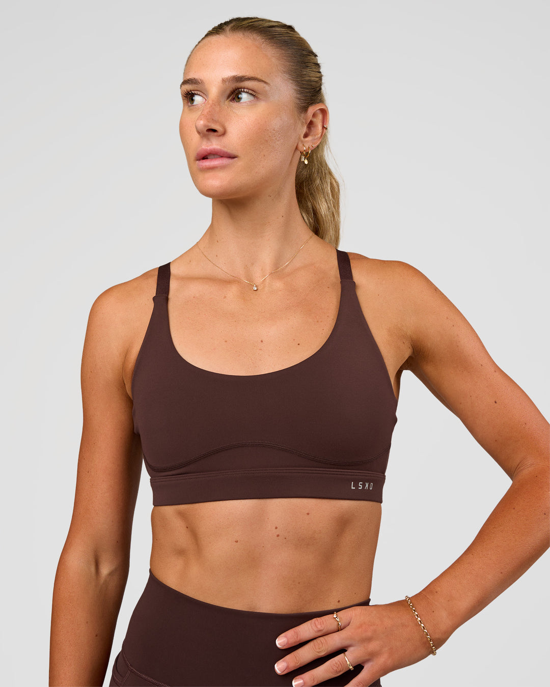 Woman wearing Rapid Sports Bra - Hot Chocolate | Model:Emelia | Size:XS - view 1