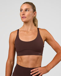 Woman wearing Rapid Sports Bra - Hot Chocolate | Model:Emelia | Size:XS | Thumbnail Index: 0