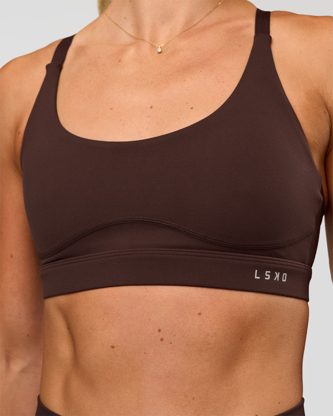 Woman wearing Rapid Sports Bra - Hot Chocolate | Model:Emelia | Size:XS - view 4