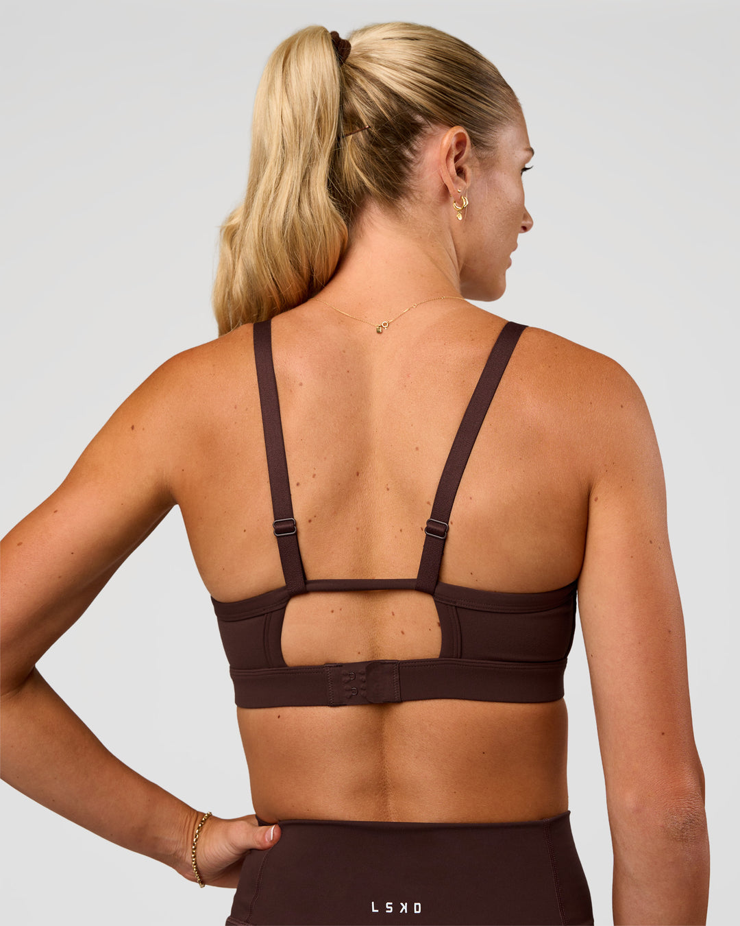 Woman wearing Rapid Sports Bra - Hot Chocolate | Model:Emelia | Size:XS - view 2