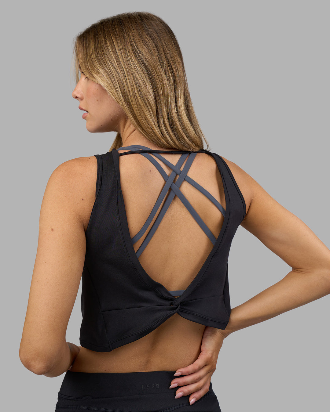 Woman wearing Restore CloudFLX Tank - Black | Model:Leilani | Size:XS - view 6