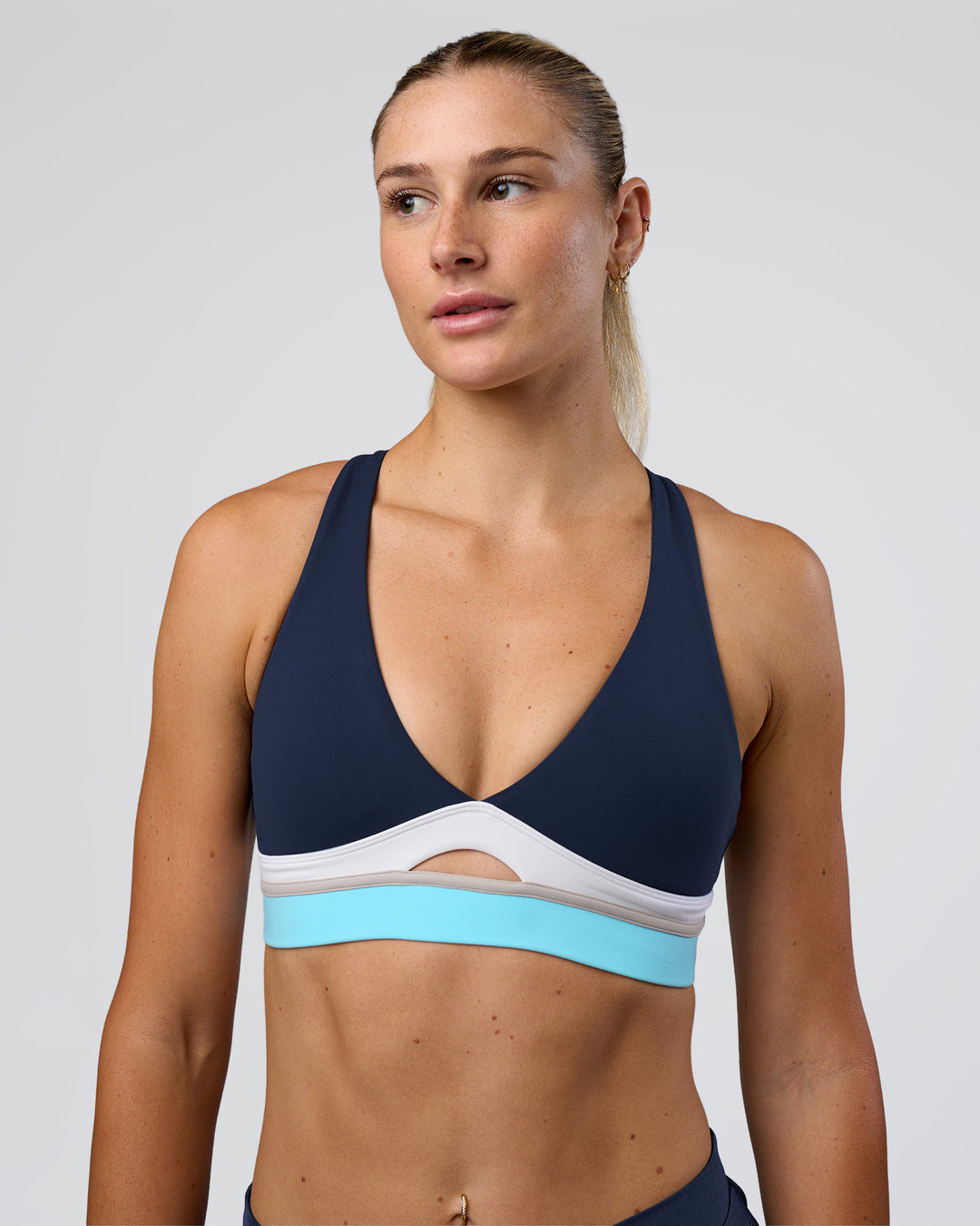 Woman wearing Revitalise Flash Sports Bra - Future Navy-Multi | Model:Emelia | Size:XS - view 1