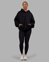 Woman wearing Rise & Lift Hoodie Oversized - Black-White | Model:Ayla | Size:XS | Thumbnail Index: 5