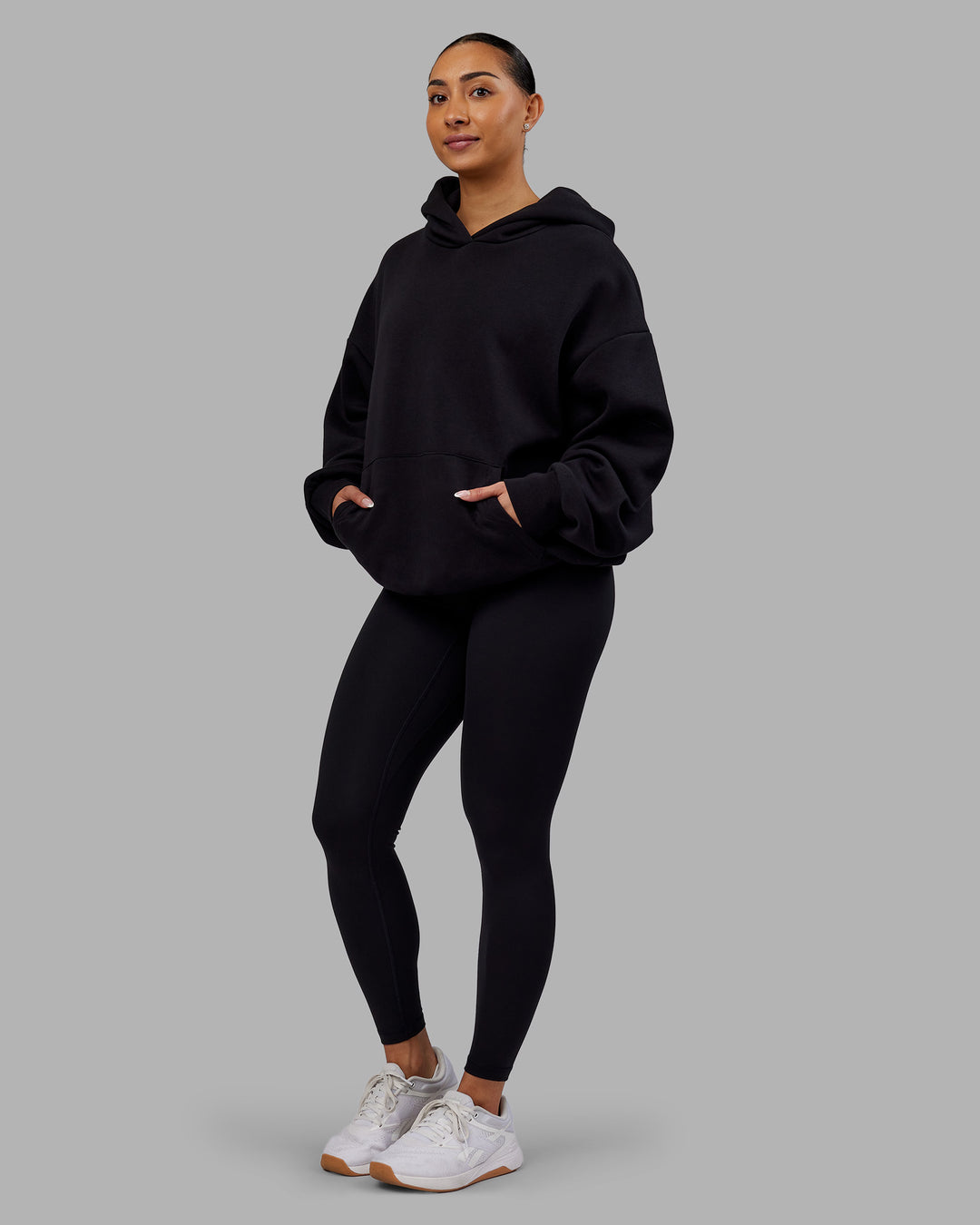 Woman wearing Rise &amp; Lift Hoodie Oversized - Black-White | Model:Ayla | Size:XS - view 10