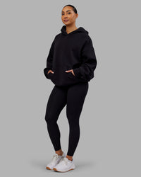 Woman wearing Rise & Lift Hoodie Oversized - Black-White | Model:Ayla | Size:XS | Thumbnail Index: 9