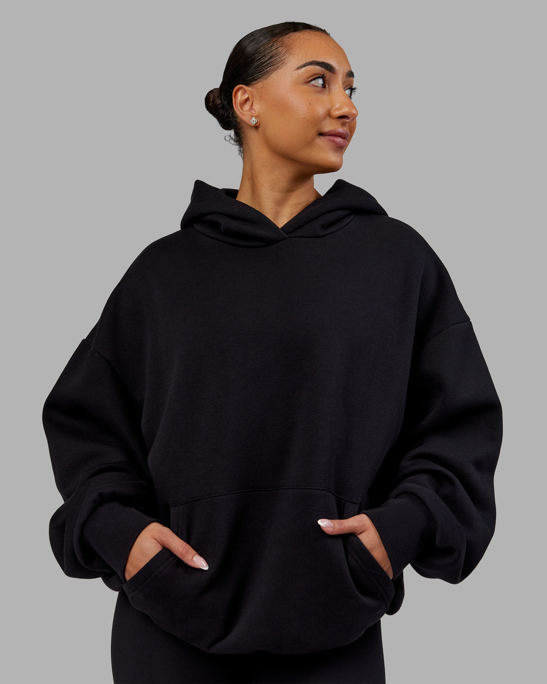 Woman wearing Rise &amp; Lift Hoodie Oversized - Black-White | Model:Ayla | Size:XS - view 4