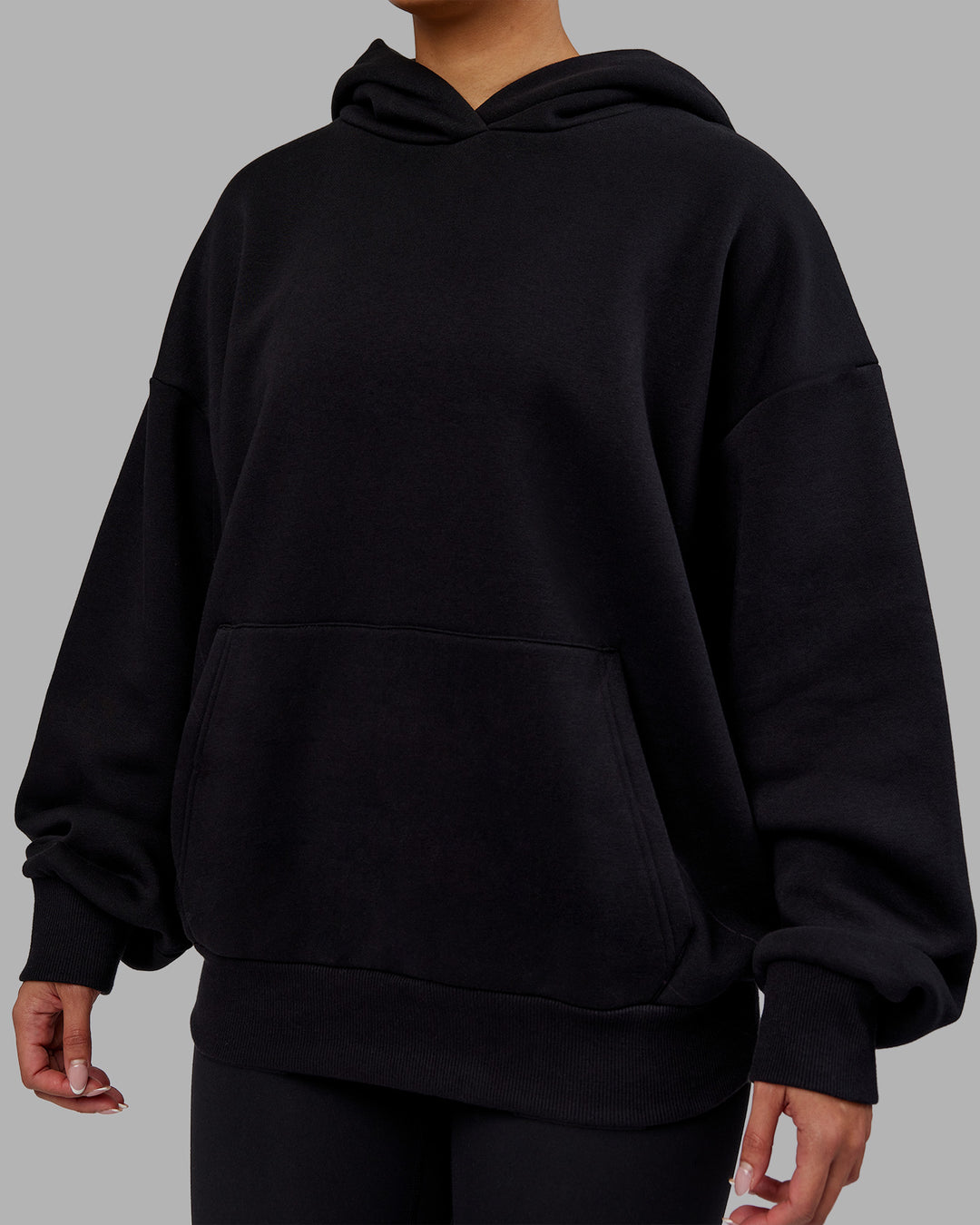 Woman wearing Rise &amp; Lift Hoodie Oversized - Black-White | Model:Ayla | Size:XS - view 8