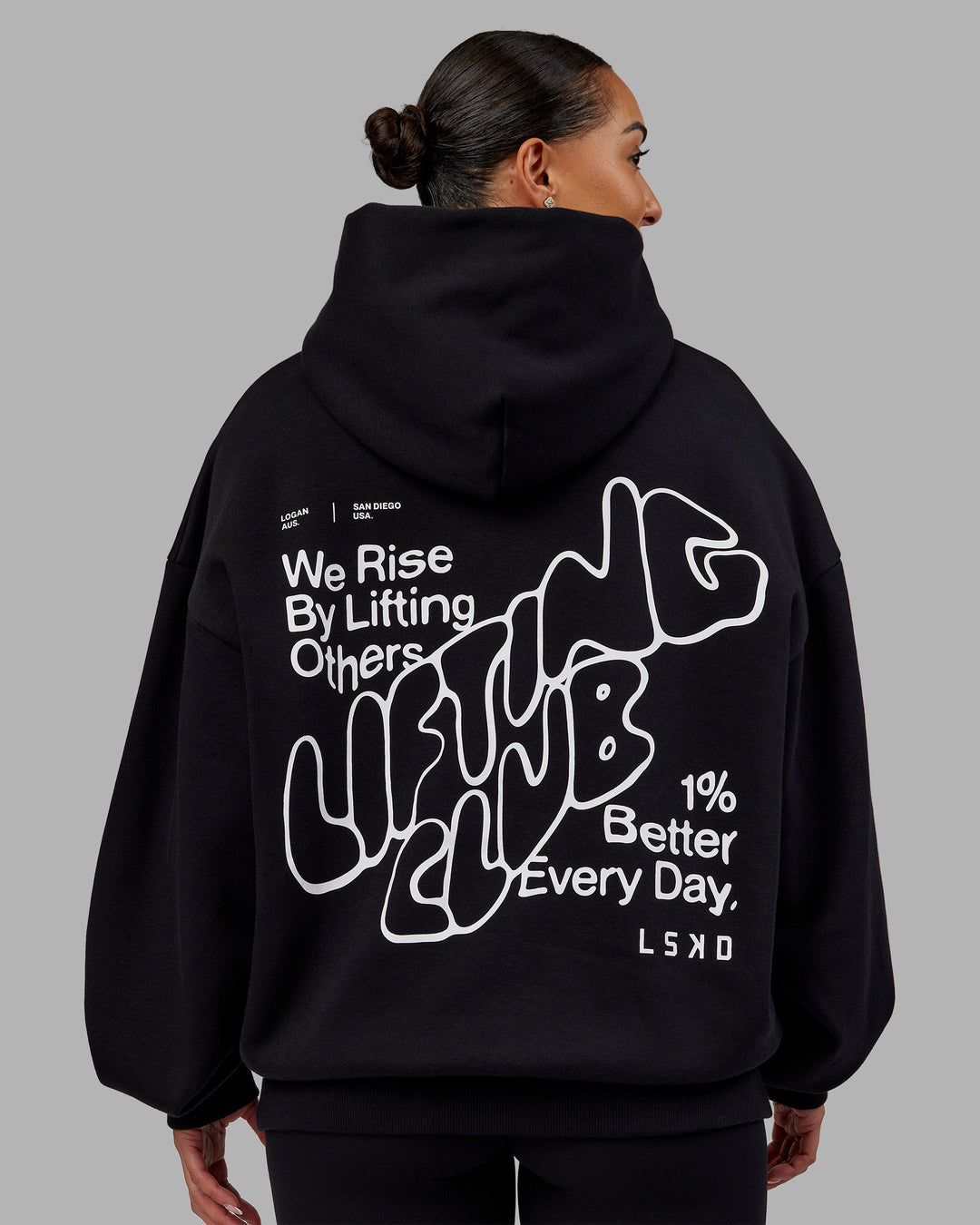 Woman wearing Rise &amp; Lift Hoodie Oversized - Black-White | Model:Ayla | Size:XS - view 2
