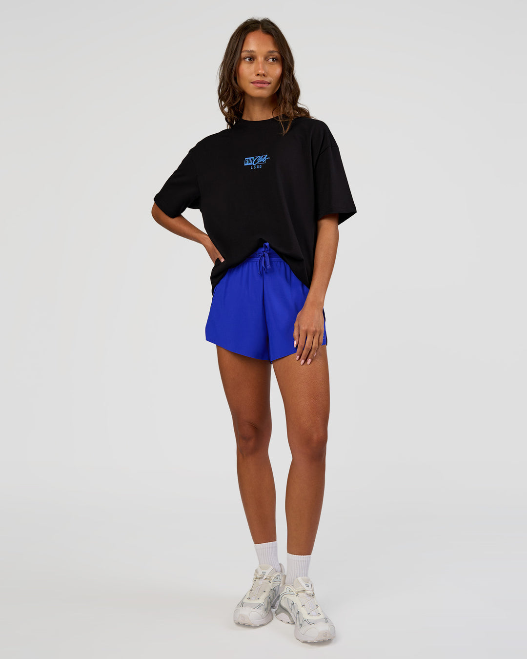 Woman wearing Run Club Script FLXCotton Oversized Tee - Black-Palace Blue | Model:Dakota | Size:XS - view 13