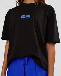 Woman wearing Run Club Script FLXCotton Oversized Tee - Black-Palace Blue | Model:Dakota | Size:XS | Thumbnail Index: 8