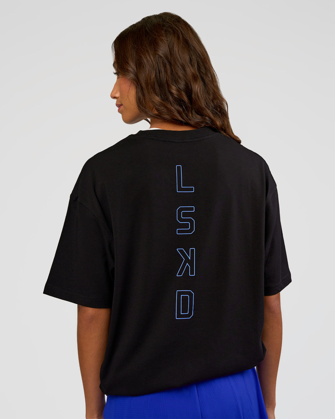 Woman wearing Run Club Script FLXCotton Oversized Tee - Black-Palace Blue | Model:Dakota | Size:XS - view 5