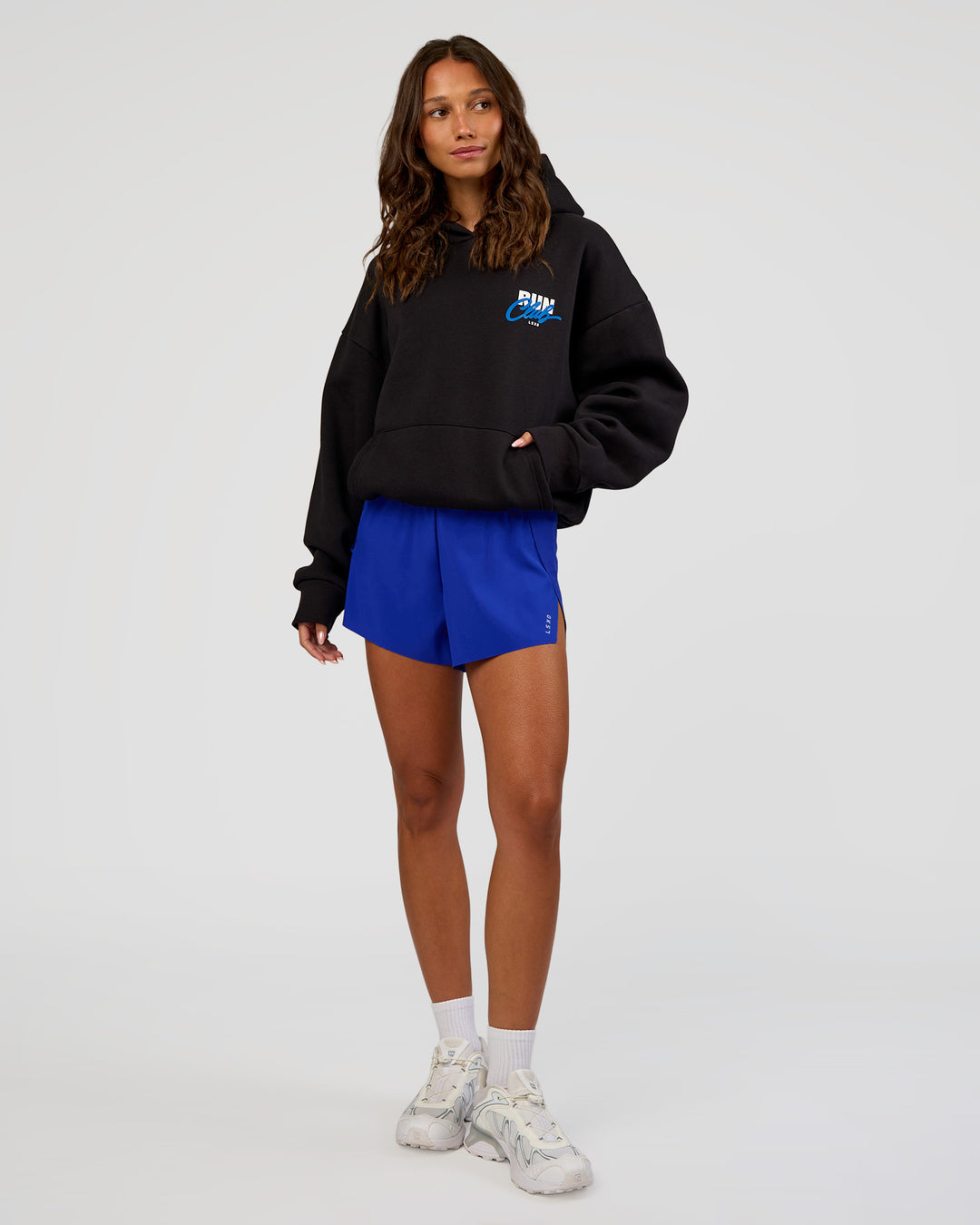 Woman wearing Run Club Script Oversized Hoodie - Black-Palace Blue | Model:Dakota | Size:XS - view 8