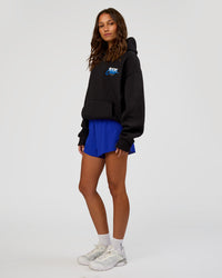 Woman wearing Run Club Script Oversized Hoodie - Black-Palace Blue | Model:Dakota | Size:XS | Thumbnail Index: 12