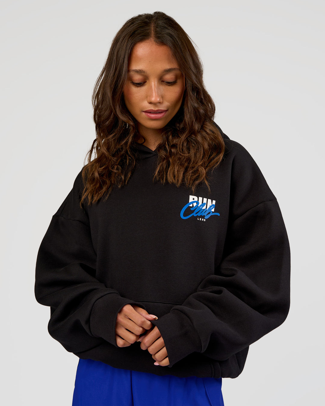 Woman wearing Run Club Script Oversized Hoodie - Black-Palace Blue | Model:Dakota | Size:XS - view 5