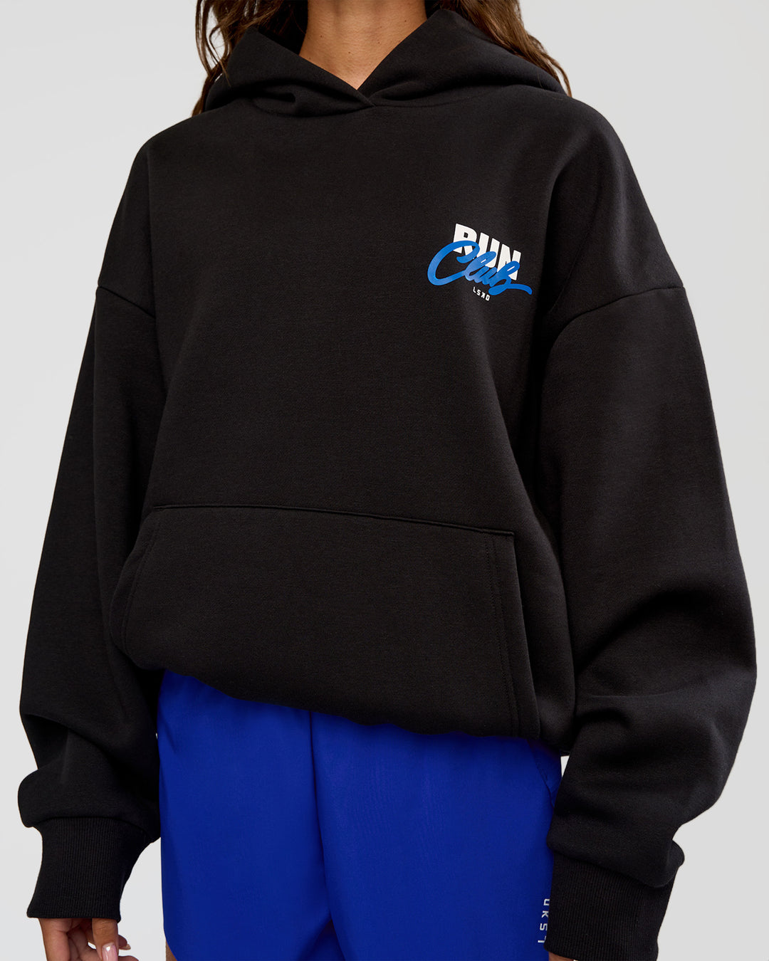 Woman wearing Run Club Script Oversized Hoodie - Black-Palace Blue | Model:Dakota | Size:XS - view 9
