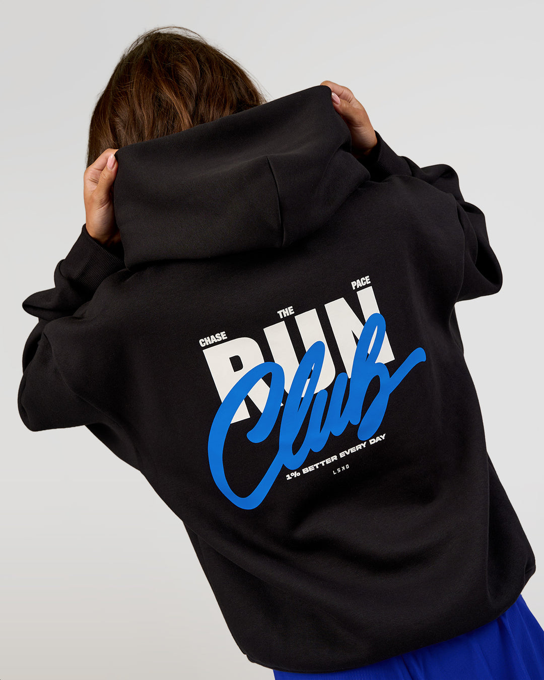 Woman wearing Run Club Script Oversized Hoodie - Black-Palace Blue | Model:Dakota | Size:XS - view 4