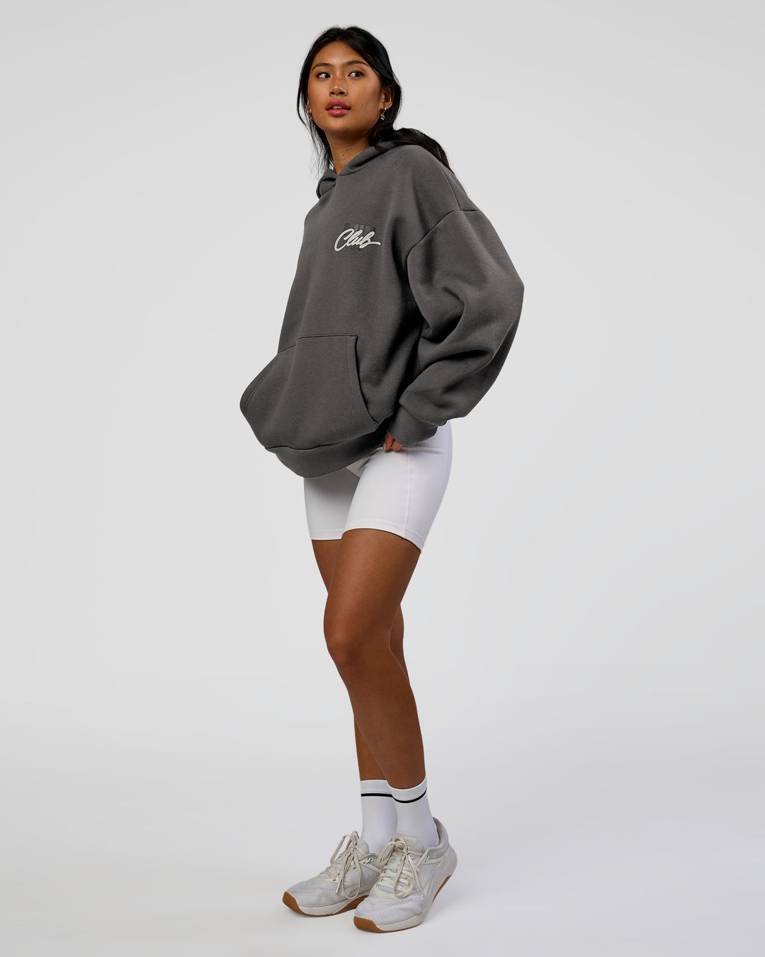 Woman wearing Run Club Script Oversized Hoodie - Dark Storm-Alloy | Model:Loren | Size:XS - view 11