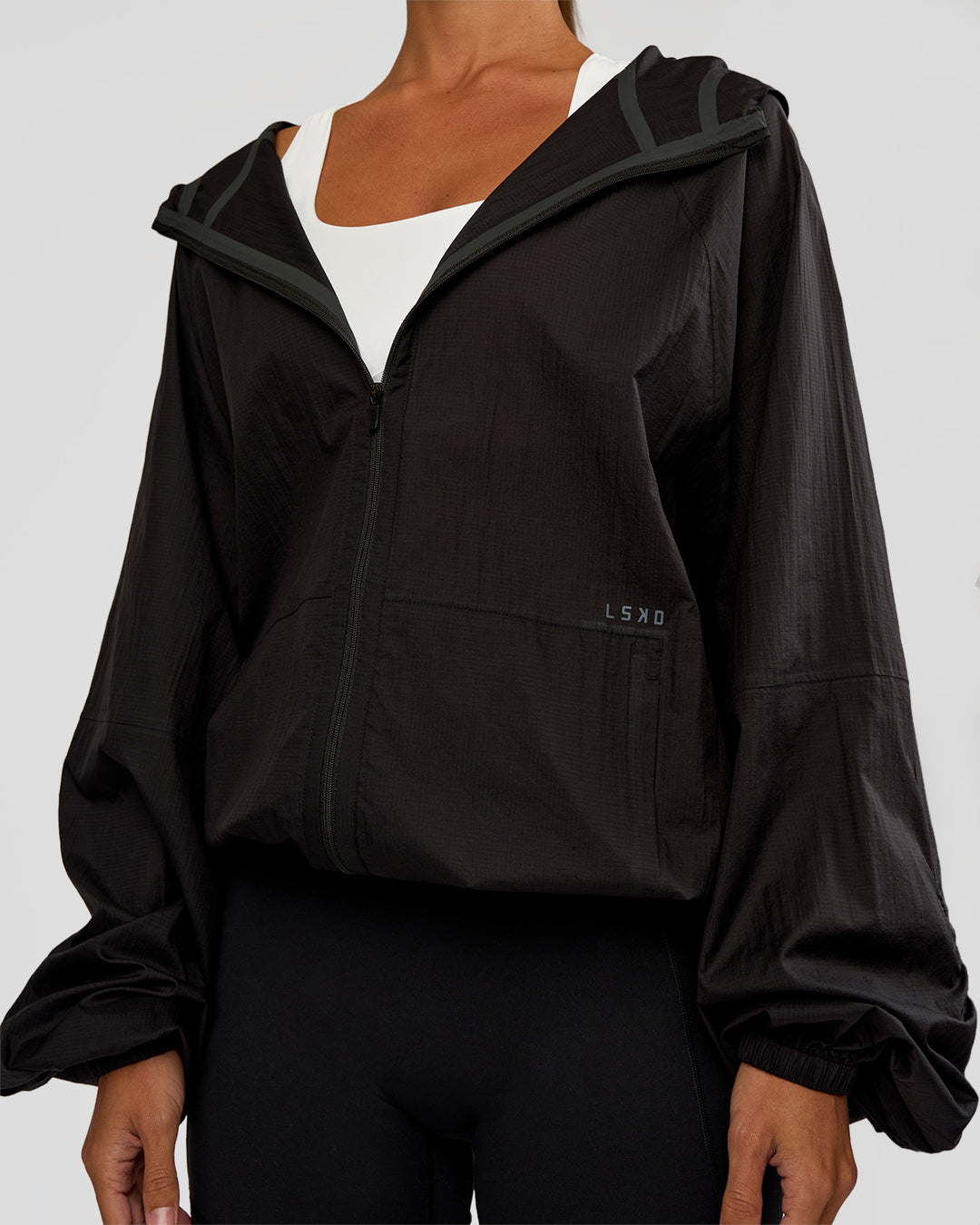 Woman wearing Run Light Jacket - Black | Model:Brylee | Size:XS - view 8