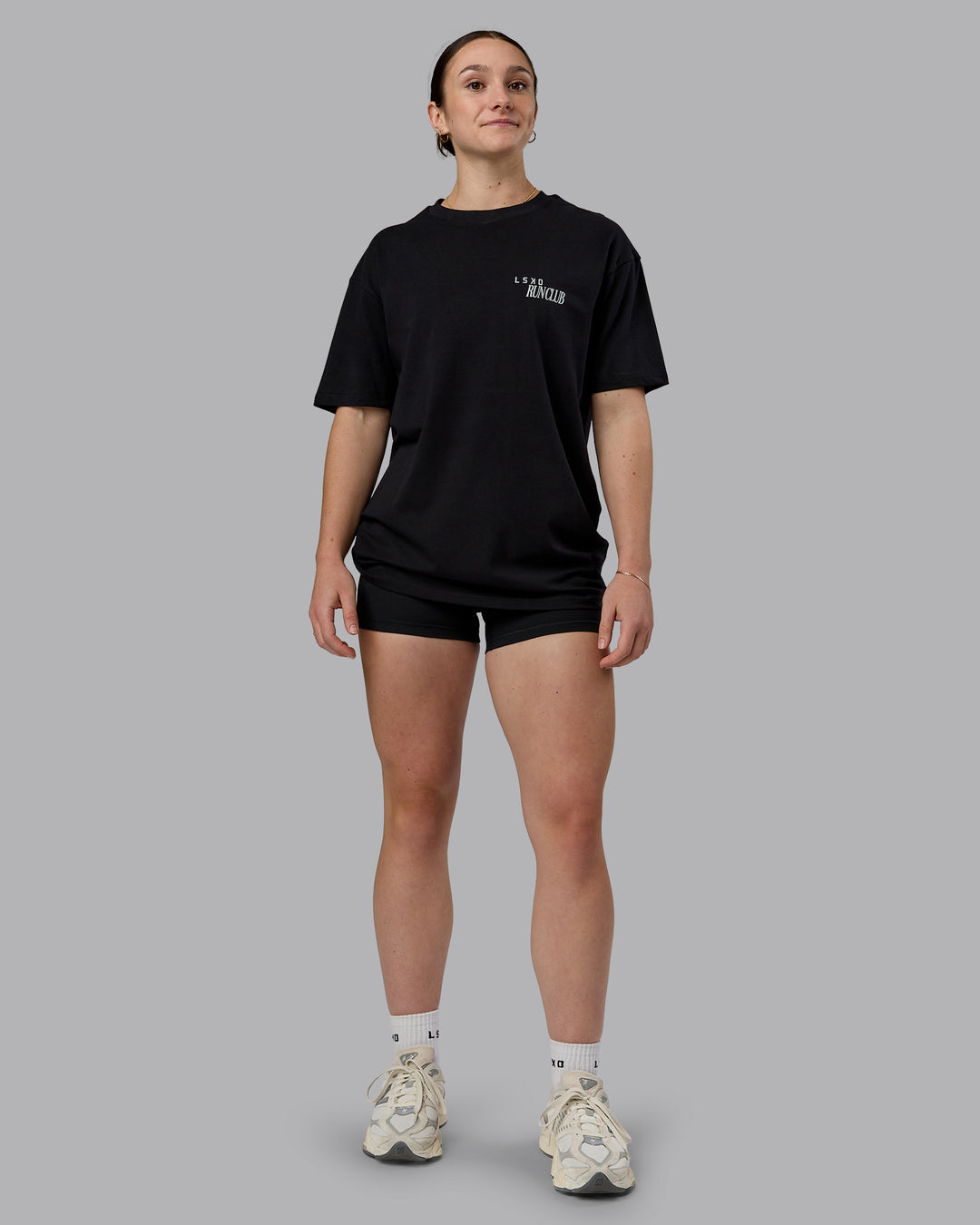 Woman wearing Run Love FLXCotton Oversized Tee - Black-Reflective | Model:Sav | Size:XS - view 10