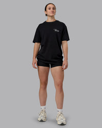 Woman wearing Run Love FLXCotton Oversized Tee - Black-Reflective | Model:Sav | Size:XS | Thumbnail Index: 9
