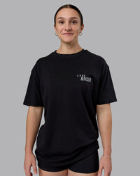 Woman wearing Run Love FLXCotton Oversized Tee - Black-Reflective | Model:Sav | Size:XS | Thumbnail Index: 3