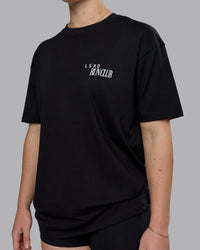 Woman wearing Run Love FLXCotton Oversized Tee - Black-Reflective | Model:Sav | Size:XS | Thumbnail Index: 8