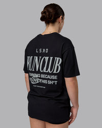 Woman wearing Run Love FLXCotton Oversized Tee - Black-Reflective | Model:Sav | Size:XS | Thumbnail Index: 2
