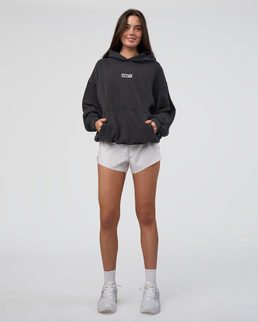 Woman wearing Runner’s Unisex Oversized Hoodie - Black Washed-White | Model:Estella | Size:XS - view 7
