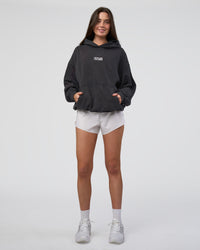 Woman wearing Runner’s Unisex Oversized Hoodie - Black Washed-White | Model:Estella | Size:XS | Thumbnail Index: 6
