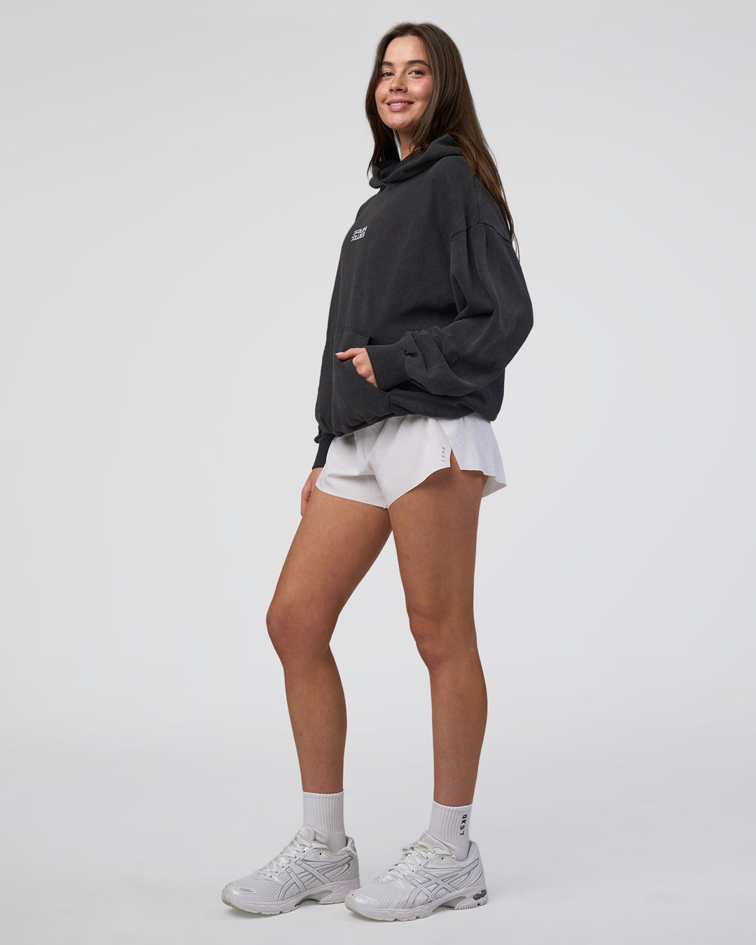 Woman wearing Runner’s Unisex Oversized Hoodie - Black Washed-White | Model:Estella | Size:XS - view 10