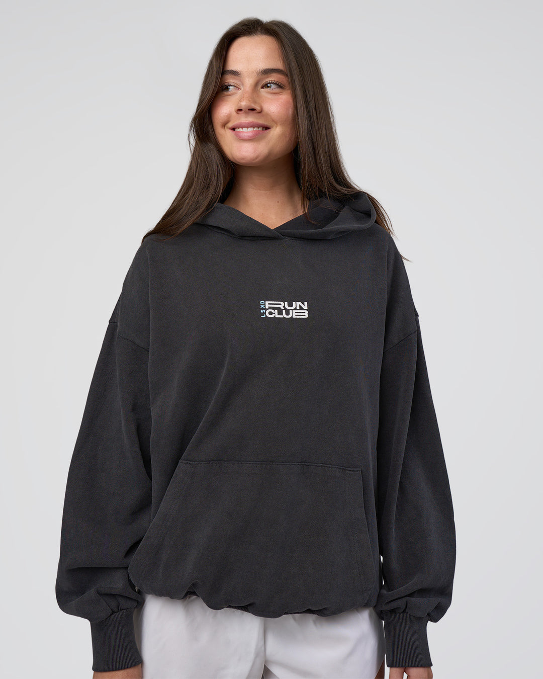 Woman wearing Runner’s Unisex Oversized Hoodie - Black Washed-White | Model:Estella | Size:XS - view 4