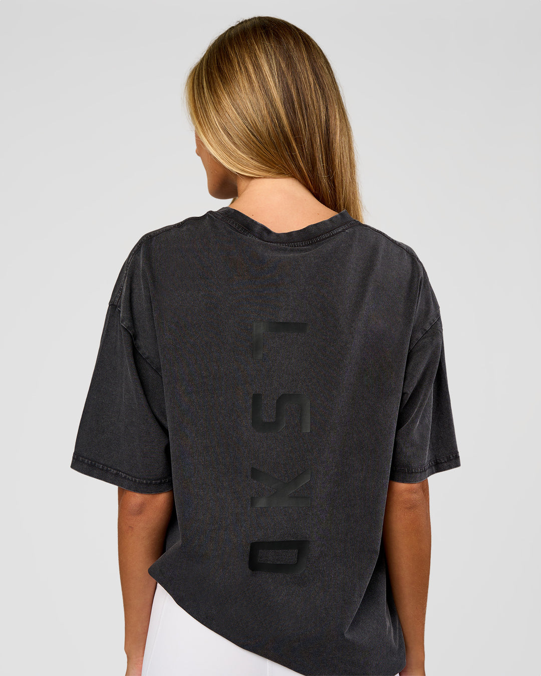 Woman wearing Shadow Mode FLXCotton Oversized Tee - Black Washed | Model:Georgia | Size:XS - view 5