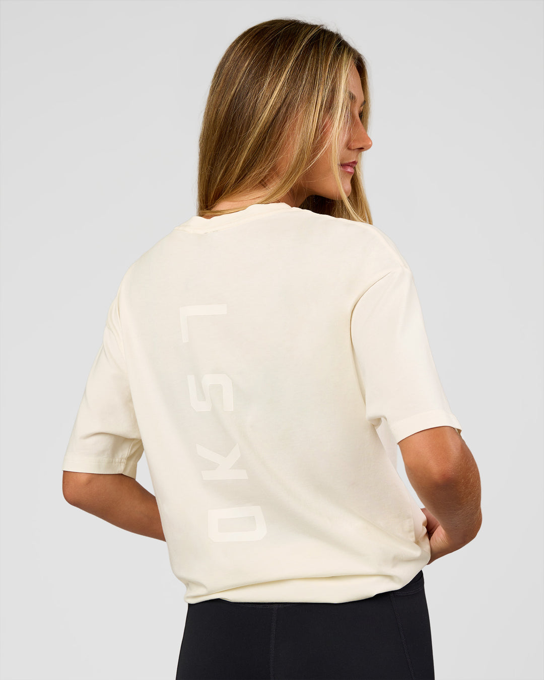 Woman wearing Shadow Mode FLXCotton Oversized Tee - Off White Washed | Model:Georgia | Size:XS - view 10
