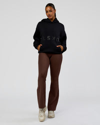 Woman wearing Shadow Mode Oversized Hoodie - Black | Model:Rosie | Size:XS | Thumbnail Index: 11