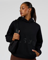 Woman wearing Shadow Mode Oversized Hoodie - Black | Model:Rosie | Size:XS | Thumbnail Index: 3