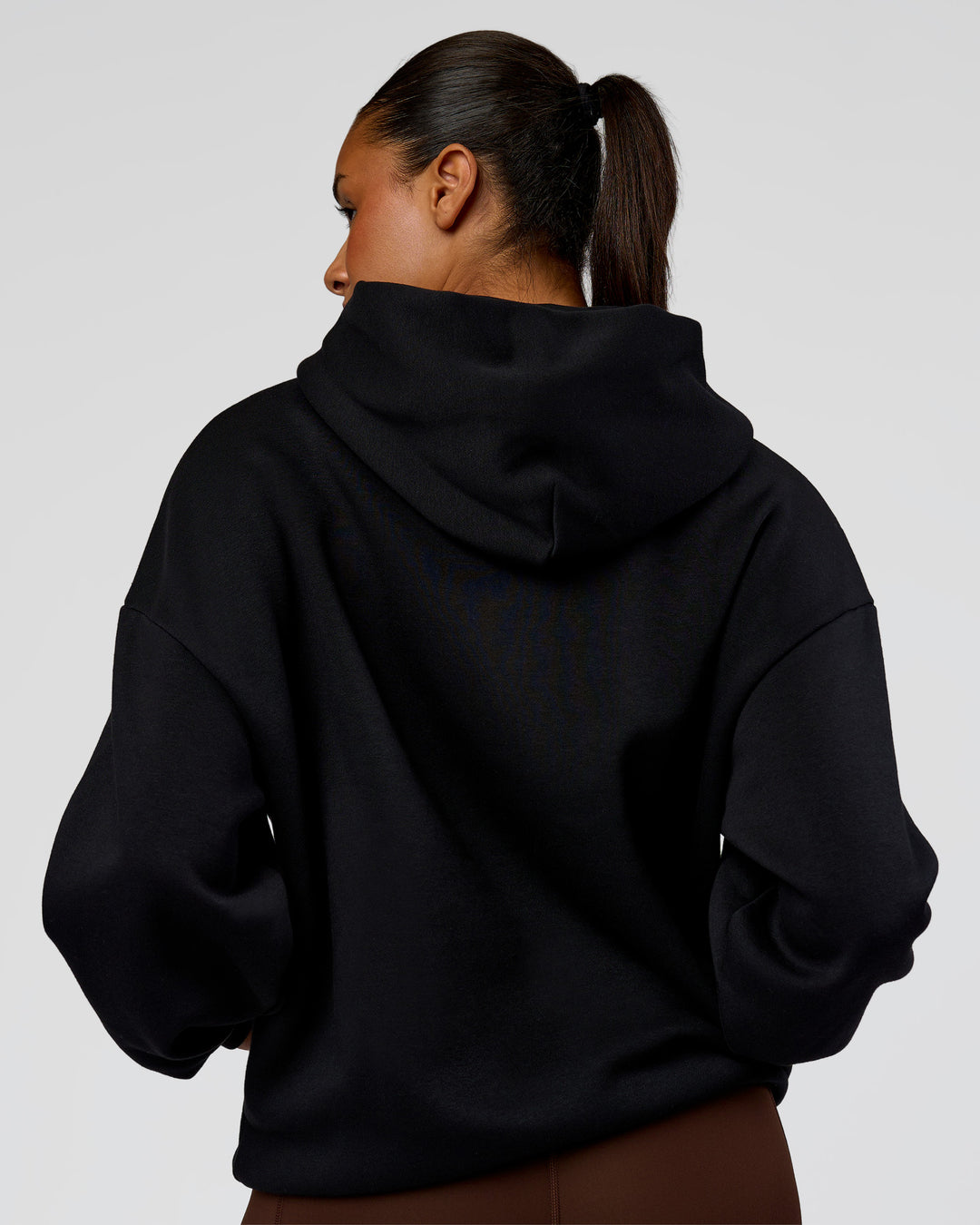 Woman wearing Shadow Mode Oversized Hoodie - Black | Model:Rosie | Size:XS - view 8