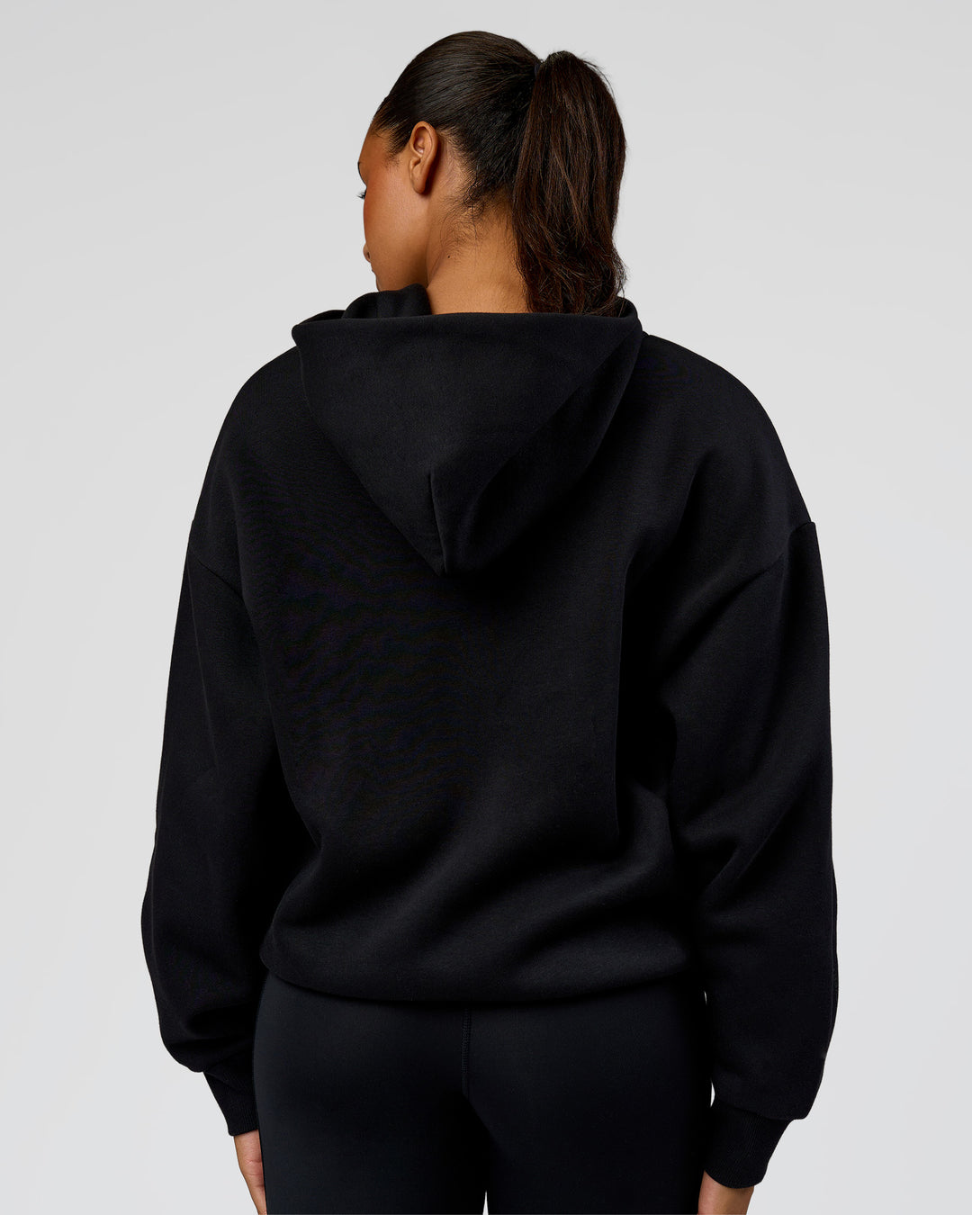 Woman wearing Shadow Mode Oversized Zip Through Hoodie - Black | Model:Rosie | Size:XS - view 10