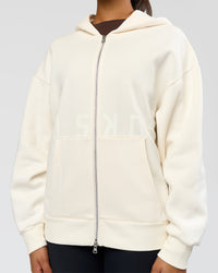 Woman wearing Shadow Mode Oversized Zip Through Hoodie - Off White | Model:Rosie | Size:XS | Thumbnail Index: 11