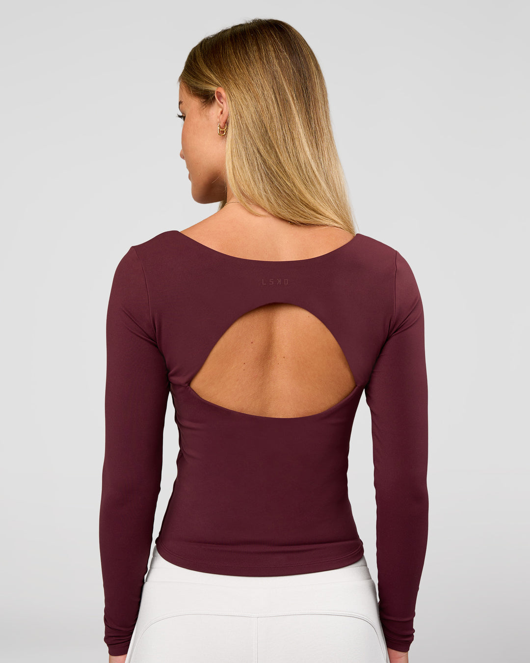 Woman wearing Show It Off Long Sleeve Top in Cherry Lacquer | Model:Issy | Size:XS - view 1