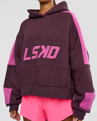 Woman wearing Slam Cropped Oversized Hoodie - Midnight Plum-Ultra Fuchsia | Model:Brylee | Size:XS | Thumbnail Index: 4