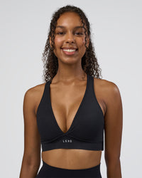 Woman wearing Stamina Sports Bra D/DD/E - Black | Model:Jordan | Size:XS | Thumbnail Index: 0