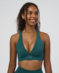 Woman wearing Stamina Sports Bra D/DD/E - Transformative Teal | Model:Jordan | Size:XS | Thumbnail Index: 0