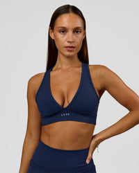 Woman wearing Stamina Sports Bra - Future Navy | Model:Brylee | Size:XS | Thumbnail Index: 0
