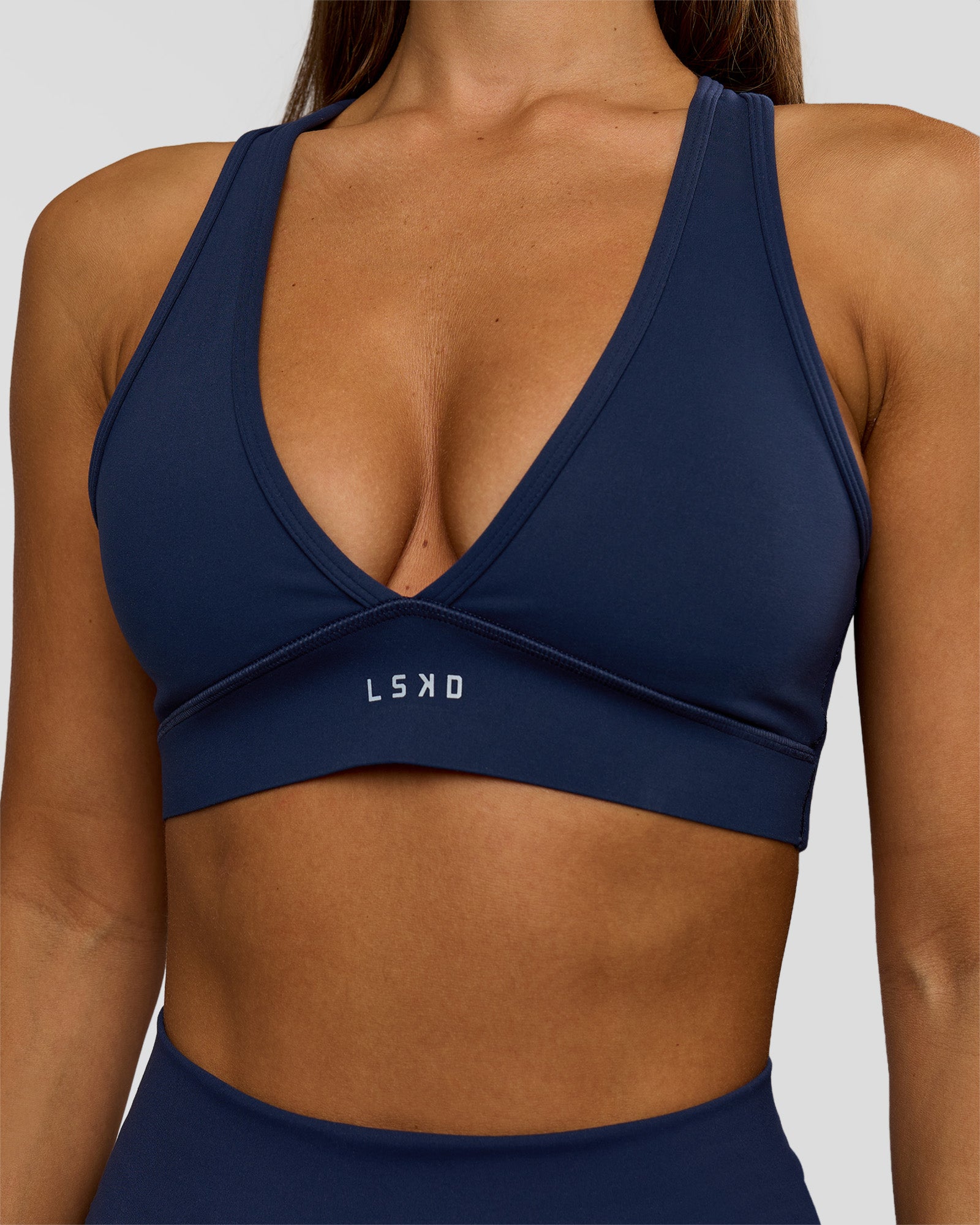 Woman wearing Stamina Sports Bra - Future Navy | Model:Brylee | Size:XS