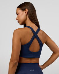 Woman wearing Stamina Sports Bra - Future Navy | Model:Brylee | Size:XS | Thumbnail Index: 2