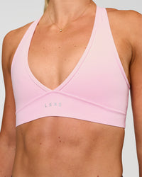 Woman wearing Stamina Sports Bra - Marshmallow | Set:true | Angle:closeup | Model:Emelia | Size:XS | Thumbnail Index: 7