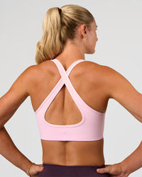 Woman wearing Stamina Sports Bra - Marshmallow | Set:true | Angle:back | Model:Emelia | Size:XS | Thumbnail Index: 4