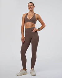 Woman wearing Stamina Sports Bra - Peppercorn | Model:Emelia | Size:XS | Thumbnail Index: 5