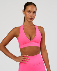 Woman wearing Stamina Sports Bra - Sugar Plum | Set:true | Angle:front | Model:Brylee | Size:XS | Thumbnail Index: 4